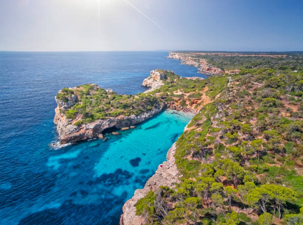 Arial View of Calo des Moro (instagram beach) , Cala s'Almunia and Peninsula of Castellet de Llevant on east coast near by Cala Llombards and Santanyí on Spanish Balearic island of Majorca / Spain stock photo