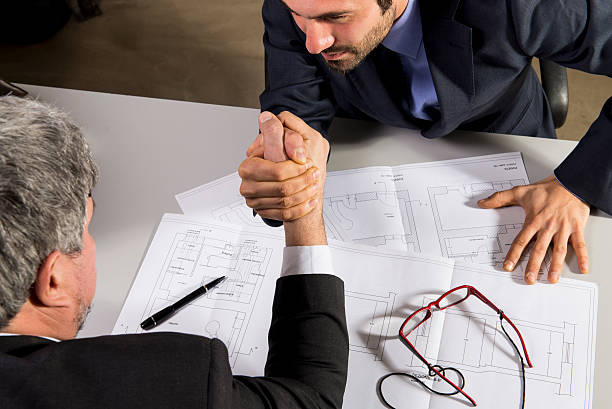 Arm wrestling on a contract stock photo
