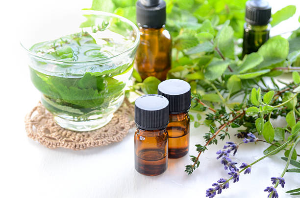 aromatherapy treatment with herbs and herbal drink stock photo