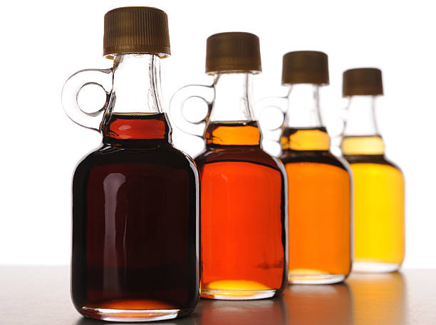 Arrangement of Maple Syrup Bottles with Various Grades stock photo