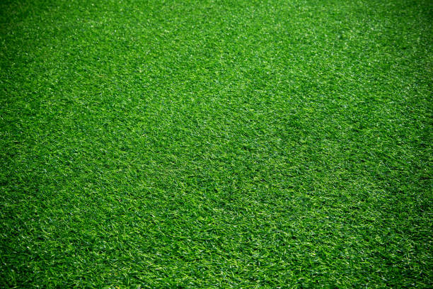 groene kunstgras getextureerde achtergrond - grass texture stockfoto's en -beelden