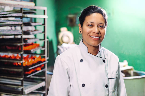 Artisan Bakery Baker portrait in small Mexican Bakery. mexican woman stock pictures, royalty-free photos & images