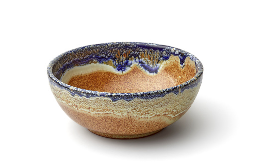 Artisan ceramic bowl on white background