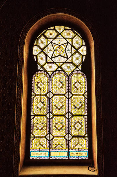 Artistic window in Spanish synagogue, Prague, Czech Artistic window in Spanish synagogue, Prague, Czech Republic. Religious architecture. Yellow photo filter. prague art stock pictures, royalty-free photos & images
