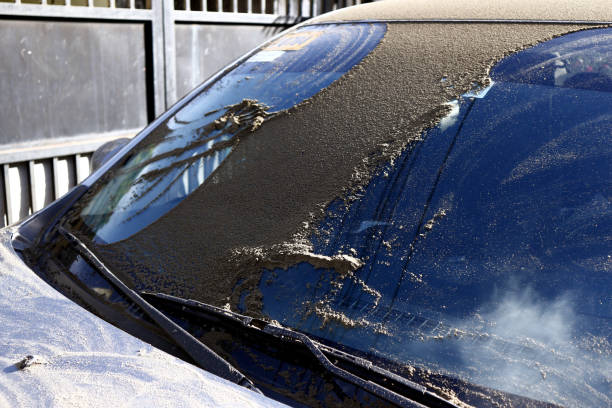 Ash from the eruption of Taal Volcano in Batangas City, Philippines accumulate on cars stock photo