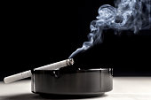 istock Ashtray cigarette and smoke 462304285
