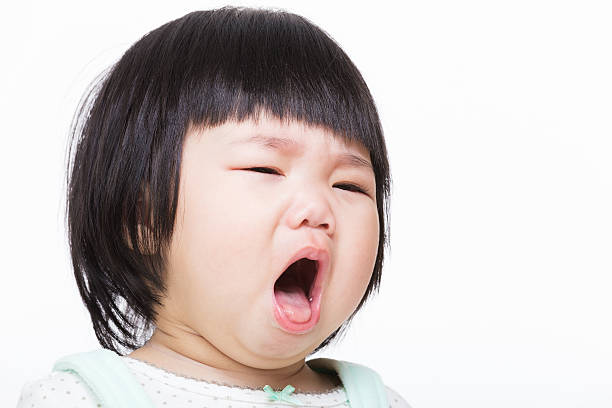 Asia baby girl cough stock photo