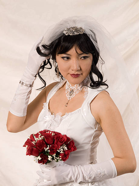 PVC Asian Bride, looking to her left stock photo
