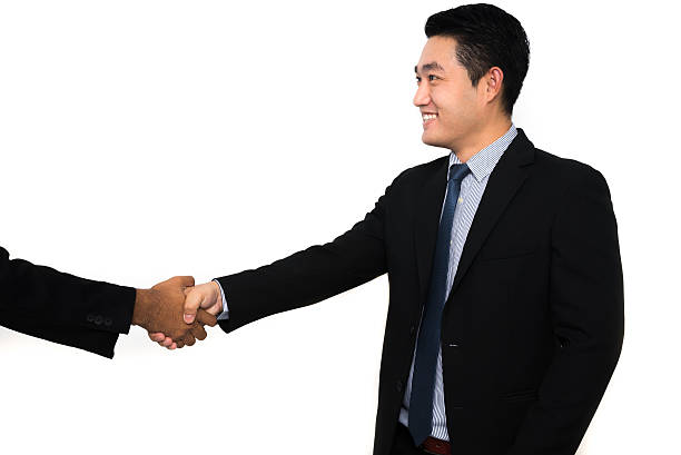 Asian businessmen handshake stock photo