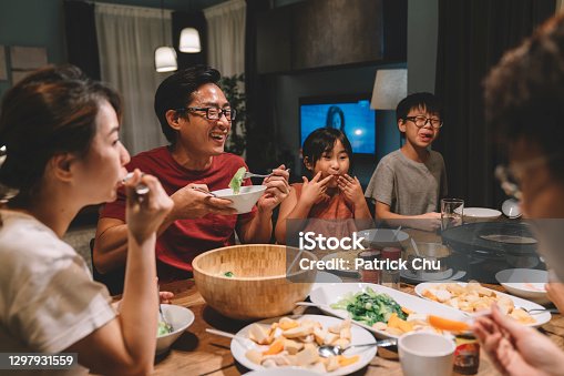 istock asian chinese family and cousins having reunion dinner at home 1297931559
