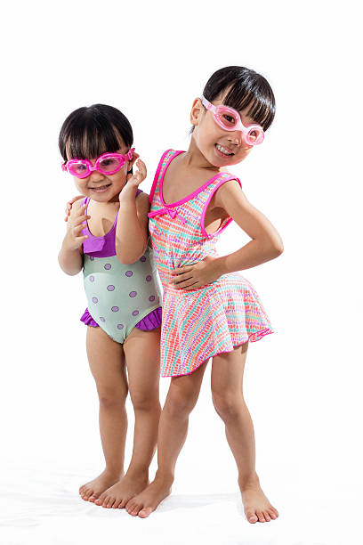 Asian Chinese little Sister portrait wearing goggles and swimsui stock photo