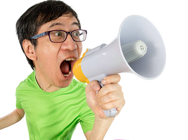 Asian Chinese Man Shouting with a Megaphone stock photo
