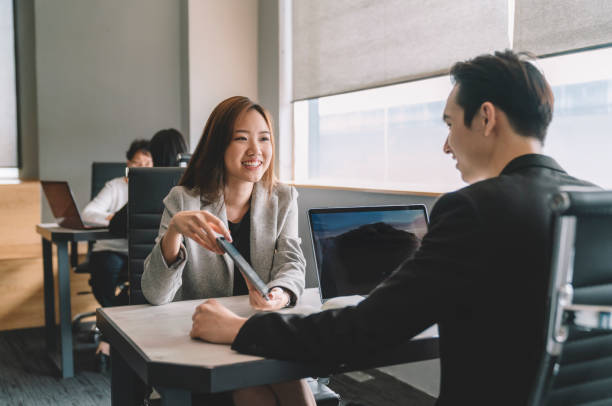 asian chinese manager and coworker having discussion in office business people scenario business adviser stock pictures, royalty-free photos & images