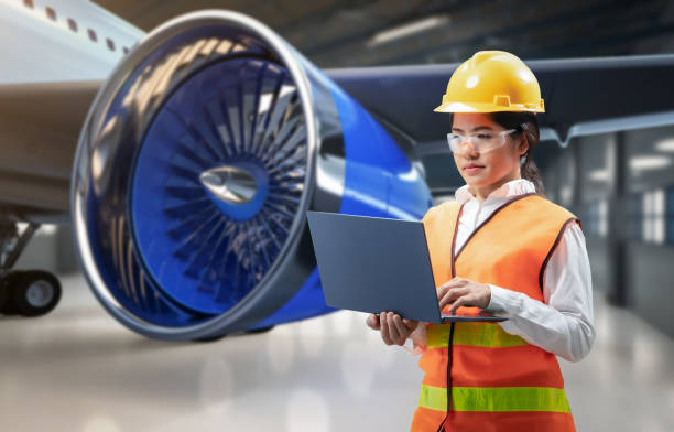 Asian engineer or technician with airplane stock photo
