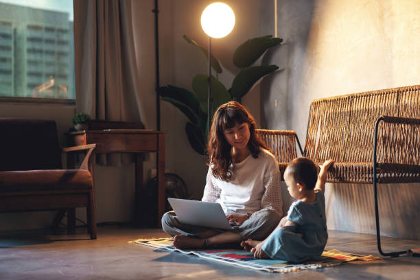 Asian Entrepreneur and Single Mum Work At home stock photo