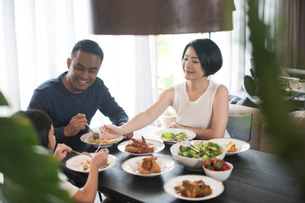 Asian family eating at home. stock photo