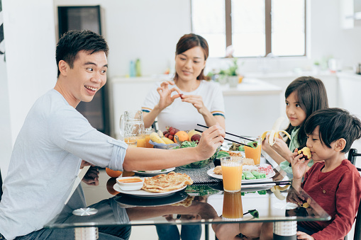 Asian Family Enjoys Healthy Meal Stock Photo - Download Image Now ...