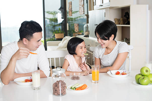 Asian Family Having Breakfast at Home stock photo