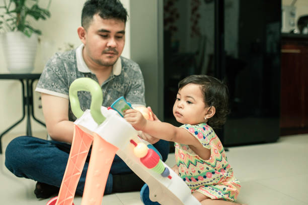 asian father playing toy  with his daughter at home asian father playing toy  with his daughter at home fathers day stock pictures, royalty-free photos & images