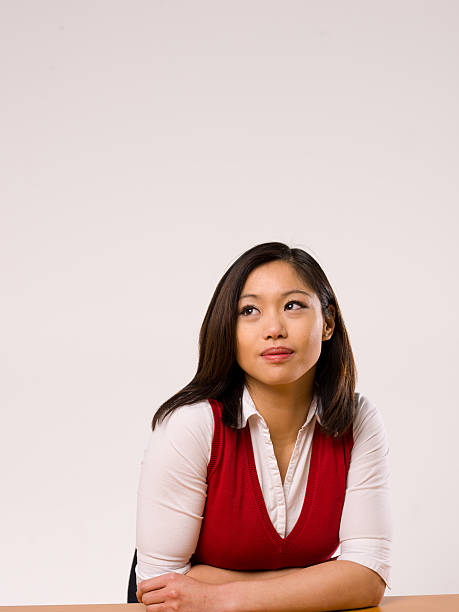 Asian female making a facial expression stock photo