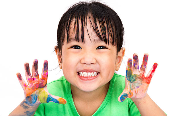 Asian Little Chinese Girl Playing and Painting stock photo
