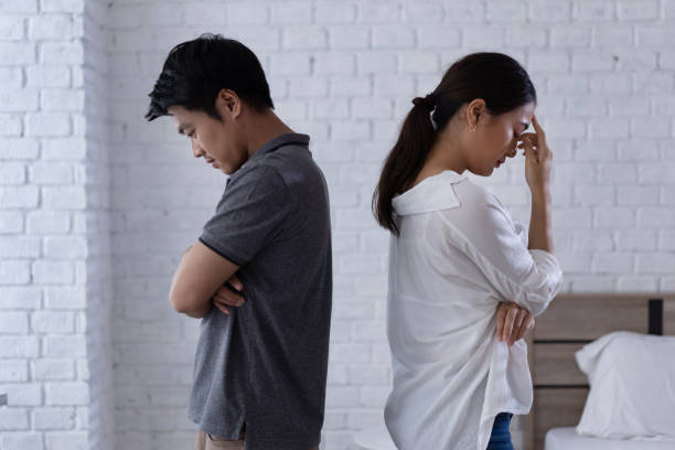 Asian lovers, they are bored and arguing unhappy. stock photo
