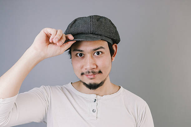 Asian man with flat cap. stock photo