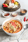 Asian Mie Noodle Soup with Tofu, Peanut, Lime and Chili in creamy coconut milk broth