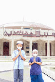 istock Asian moslem boys Eid greetings with mask covid-19 1391338710