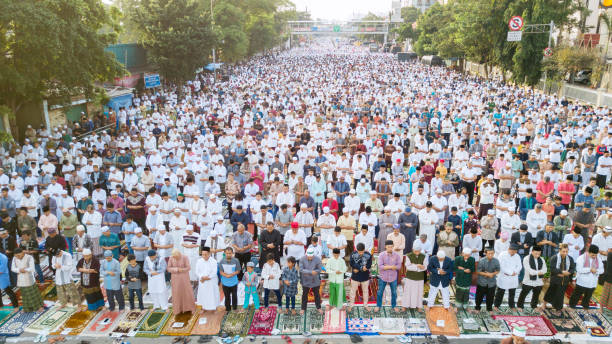 Asian Muslim during Eid Al Fitr prayer stock photo