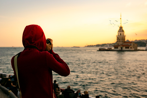 asian traveler with the maiden's tower view in Istanbul city, turkey
