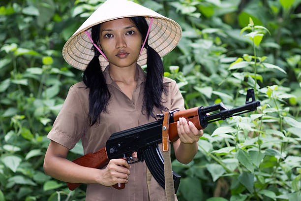 Asian woman armed stock photo