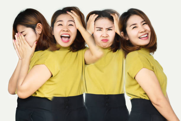 Asian woman having mood swings with different emotions ,multiple personality disorder concept stock photo