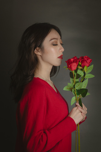 Asian Woman Holding Red Rose In Hands Stock Photo - Download Image Now -  iStock