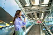istock Asian woman is taking the escalator to get a taxi. 1333066605