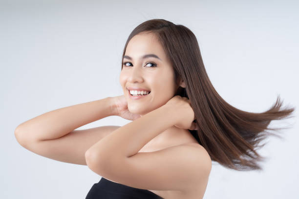 Asian woman, she is happy with her hair. stock photo