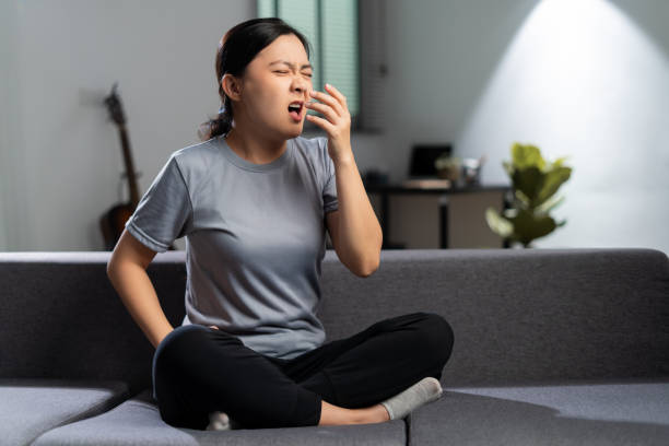 Asian woman was sick with fever getting cough. stock photo