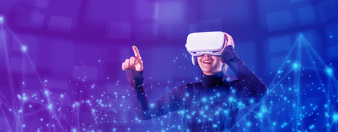 Asian woman wearing VR headset for entertainment in the metaverse. Augmented reality. Future digital technology game and entertainment. Metaverse technology concept.