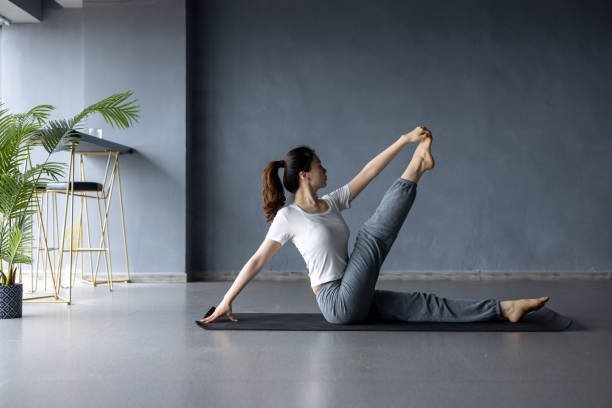 Asian women do yoga at home stock photo