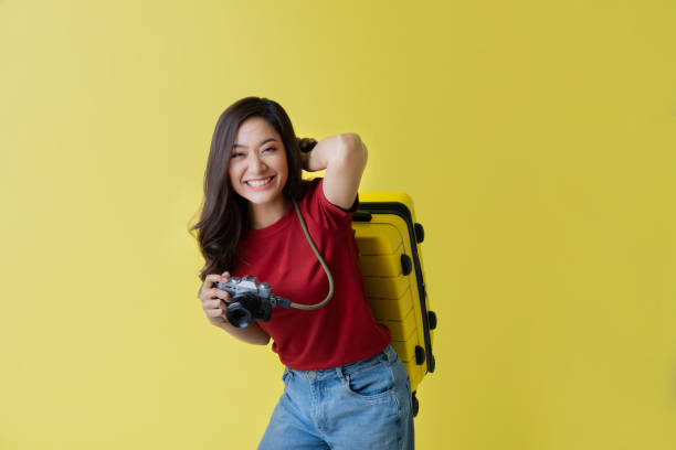 Asian women tourists she is excited to travel.In the studio stock photo