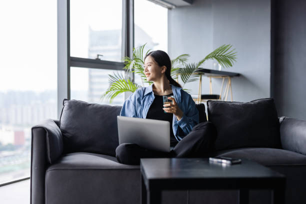 Asian women working at home stock photo