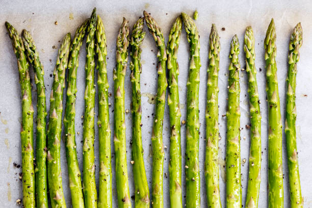 Asparagus Spears on Oven Tray ready for Roasting stock photo
