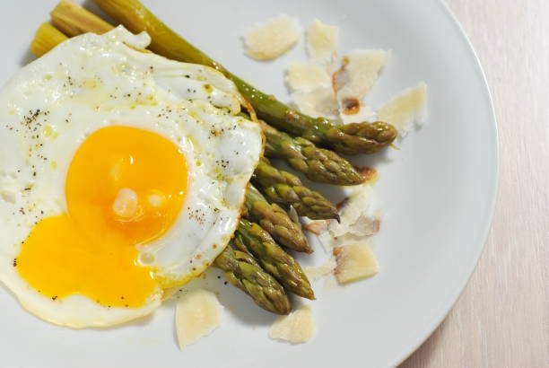 Asparagus with poached egg stock photo