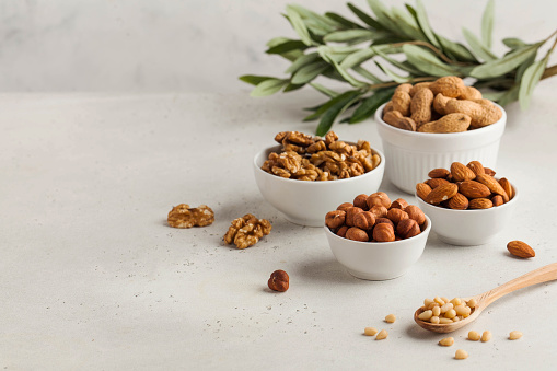 Assorted nuts. The dried nuts, hazelnuts, almonds, walnuts and others. Healthy food, healthy snacks. Copy space. High quality photo