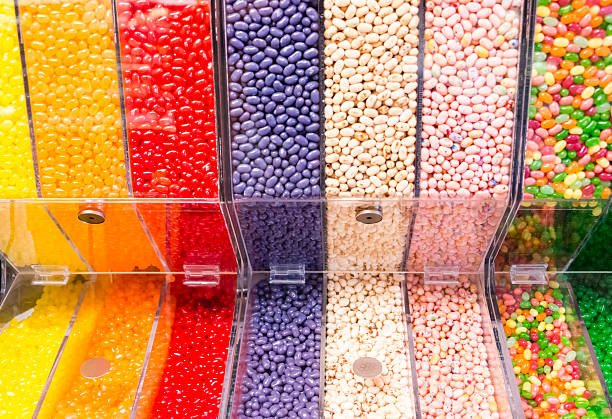 XXXL: Assorted variety of colorful jelly beans Assorted variety of colorful jelly beans in clear plastic container in a candy store. candy store stock pictures, royalty-free photos & images