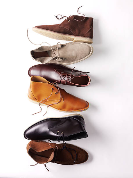 Assortment of chukka boots on a white background stock photo