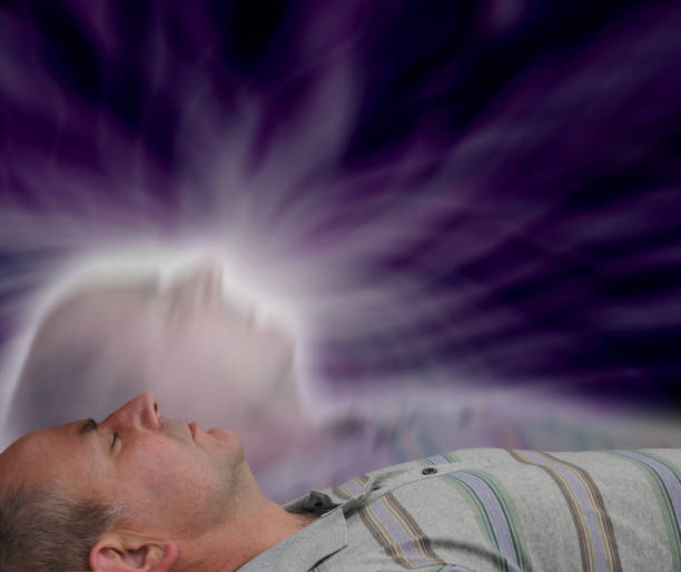 Astral Projection Male supine with eyes closed and soul astral projection  effect on dark background aura photos stock pictures, royalty-free photos & images