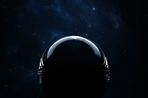 Astronaut helmet is a reflection of stars and galaxies. Space exploration, an astronaut looks up into space. 3d render