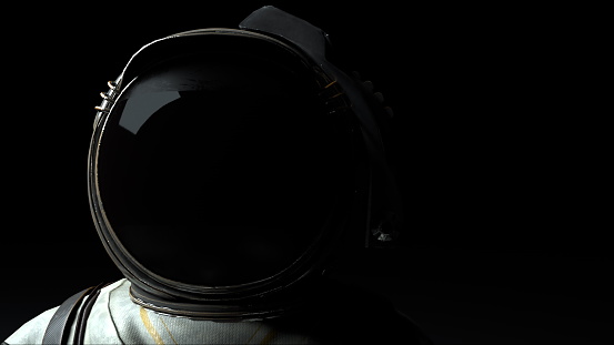 Cosmonaut in a metal helmet close-up in the light and dark. Computer generated space background, 3D rendering