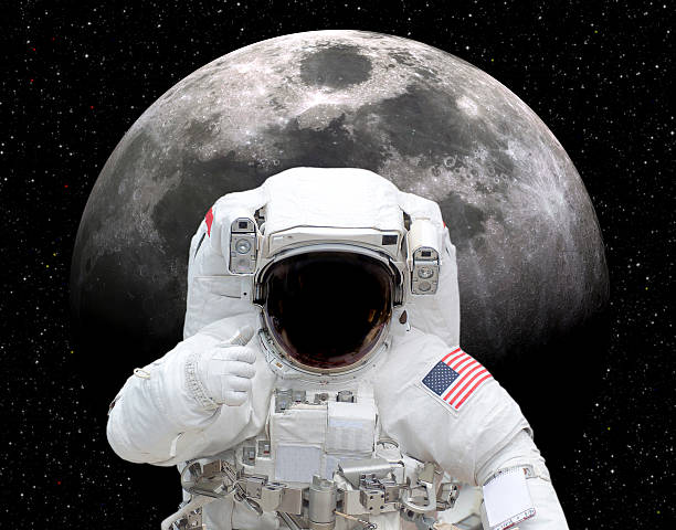 Astronaut in space giving thumbs up to moon Astronaut in space giving thumbs up to moon. This stock image has a horizontal composition. moon photos stock pictures, royalty-free photos & images